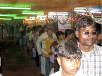 Inside gathering of pilgrims in exhibition Vasant Panchami