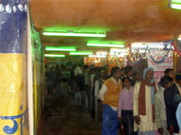 Inside gathering of pilgrims in exhibition Makar Sankranti