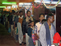 Inside gathering of pilgrims in exhibition on Purnima