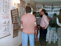 Local people watch charts & data in exhibition campus